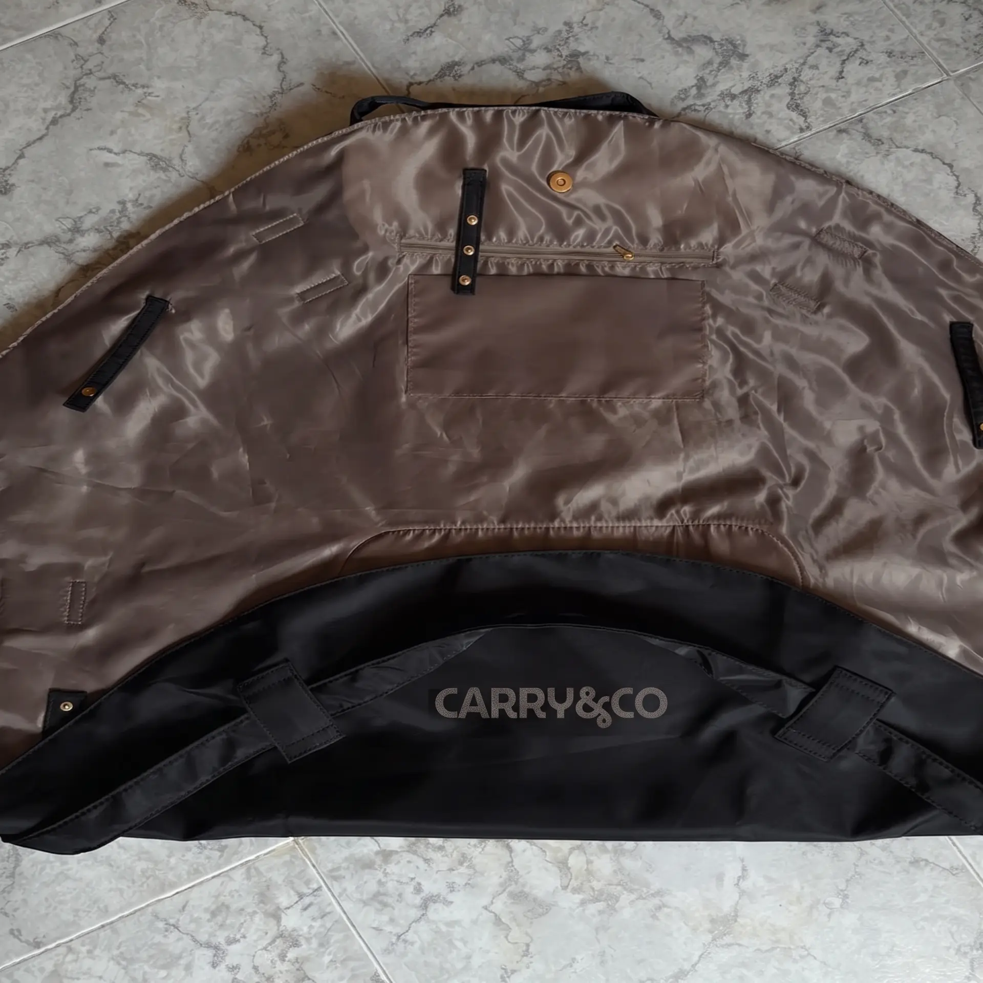The bag opened flat showing the silky lining and inner pocket